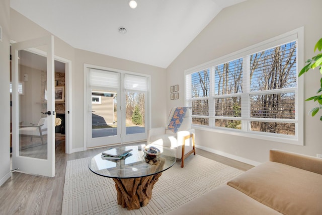 11163 184th Cir NW, Elk River, MN 55330 - sitting room with light wood-type flooring, french doors, baseboards, and lofted ceiling