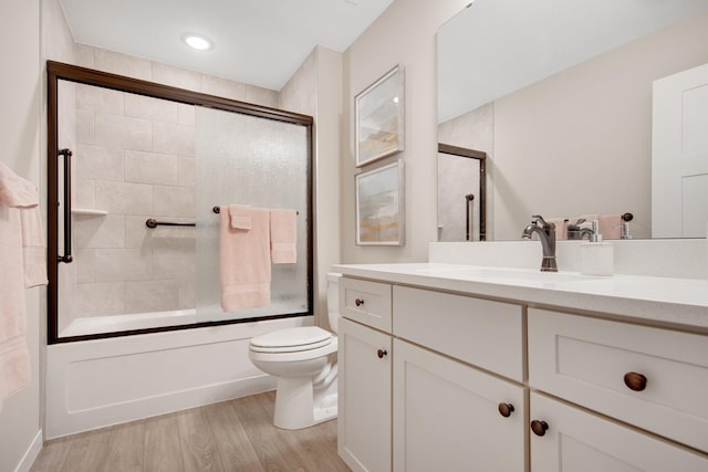 11163 184th Cir NW, Elk River, MN 55330 - full bathroom with toilet, recessed lighting, wood finished floors, combined bath / shower with glass door, and vanity
