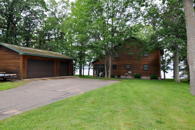 10179 Mounds Point Dr NW, Leech Lake Twp, MN 56633 - view of front of property with a front lawn, a garage, and an outdoor structure