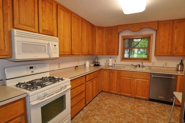 10179 Mounds Point Dr NW, Leech Lake Twp, MN 56633 - kitchen featuring white appliances, light countertops, and brown cabinetry