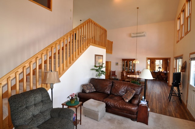 10179 Mounds Point Dr NW, Leech Lake Twp, MN 56633 - living area featuring a high ceiling, stairway, and wood finished floors
