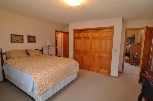 10179 Mounds Point Dr NW, Leech Lake Twp, MN 56633 - bedroom with light colored carpet, a closet, and a textured ceiling