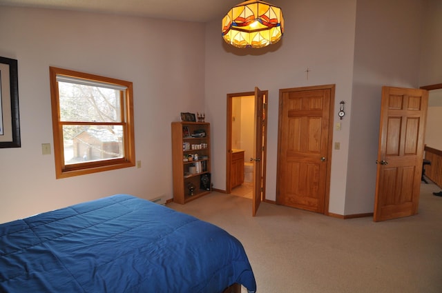 10179 Mounds Point Dr NW, Leech Lake Twp, MN 56633 - bedroom featuring light carpet, a high ceiling, and ensuite bathroom