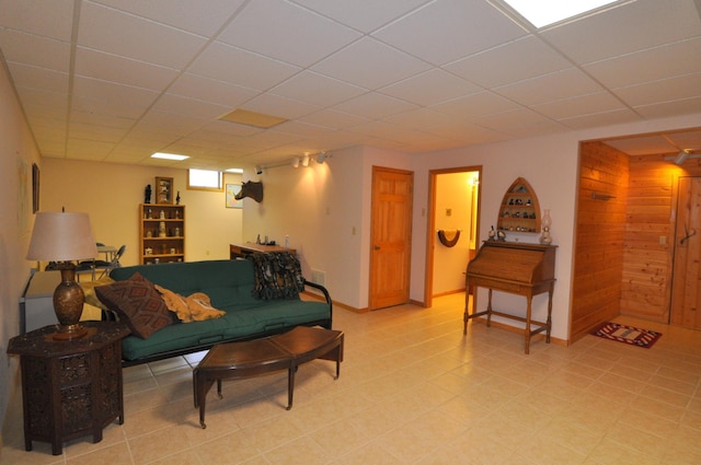 10179 Mounds Point Dr NW, Leech Lake Twp, MN 56633 - living room featuring a paneled ceiling and wood walls
