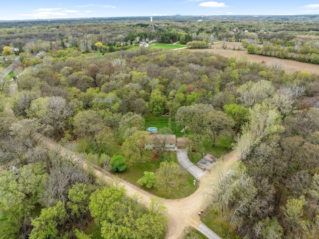 birds eye view of property featuring a view of trees