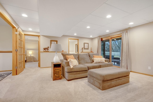 living room featuring baseboards, carpet flooring, and recessed lighting