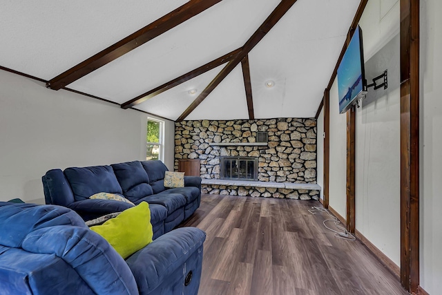 2021 6th St SW, Willmar, MN 56201 - living area with wood finished floors, a stone fireplace, and baseboards