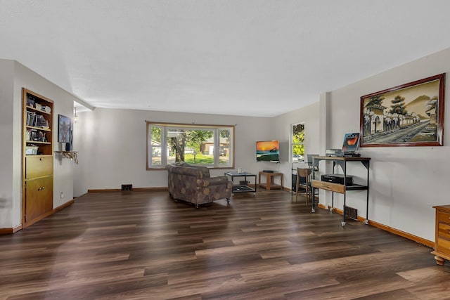 2021 6th St SW, Willmar, MN 56201 - living room featuring wood finished floors and baseboards