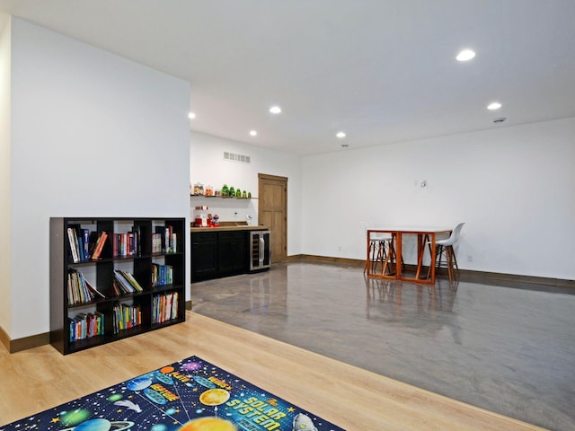 game room with recessed lighting, visible vents, baseboards, and wine cooler