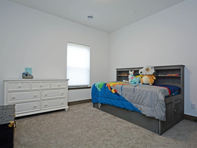 carpeted bedroom with visible vents and baseboards