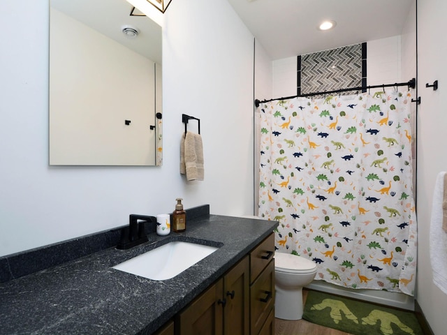 bathroom featuring toilet, shower / bath combination with curtain, recessed lighting, vanity, and a skylight