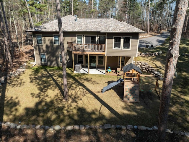 back of house featuring a patio and a wooden deck