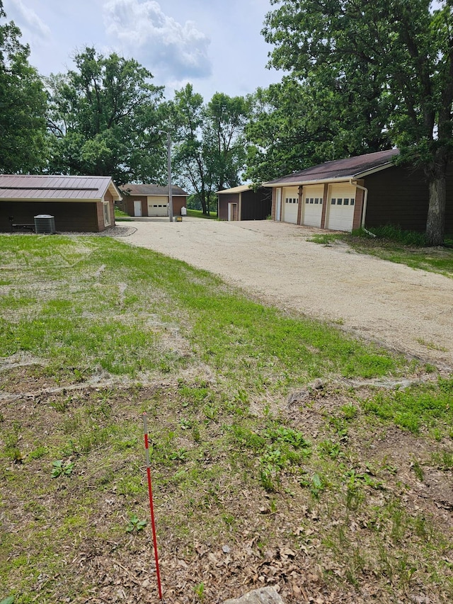 6788 39th Ave NW, Garfield, MN 56332 - view of yard with an outbuilding and a detached garage