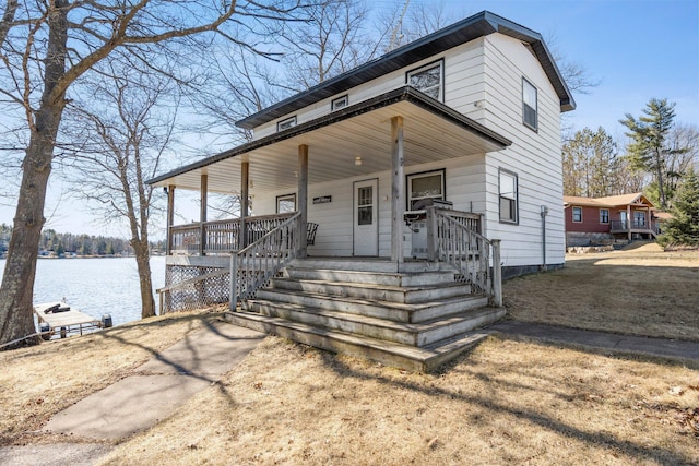 view of front of home featuring a porch and a water view