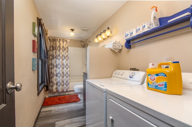 314 High St, Lake City, MN 55041 - laundry room with washing machine and dryer, wood finished floors, visible vents, and laundry area
