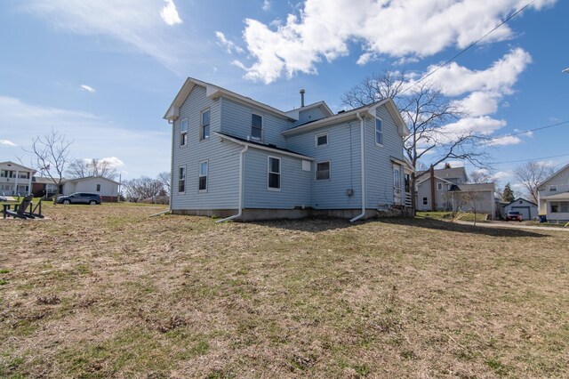 314 High St, Lake City, MN 55041 - rear view of house with a yard