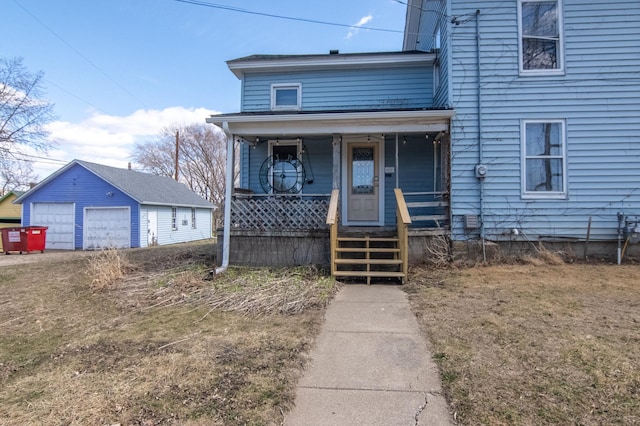 314 High St, Lake City, MN 55041 - traditional-style house with an outdoor structure, covered porch, and a detached garage