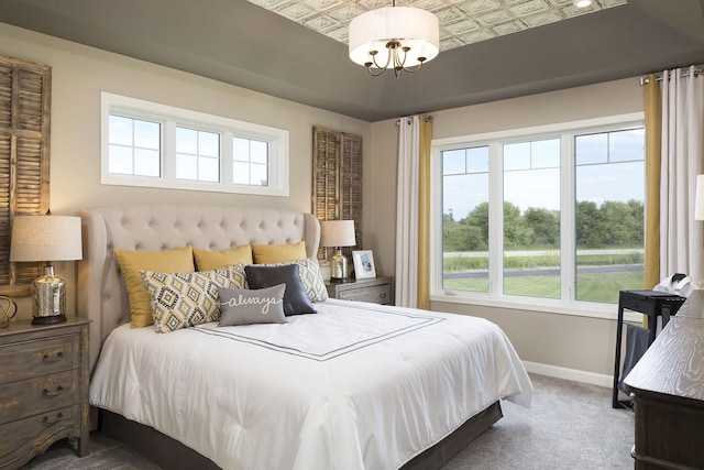 10518 28th St NE, Saint Michael, MN 55376 - bedroom with an ornate ceiling, multiple windows, carpet, and a chandelier