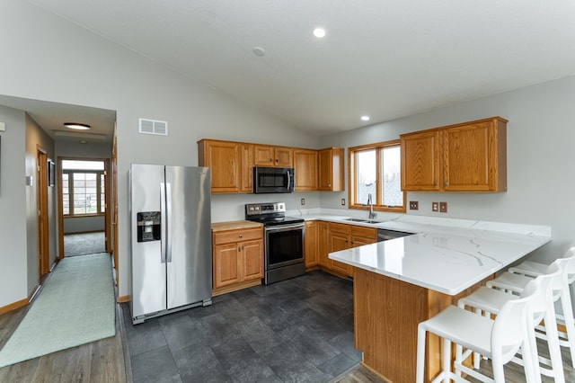 506 6th Pl NE, Byron, MN 55920 - kitchen featuring visible vents, a peninsula, a sink, a wealth of natural light, and stainless steel appliances