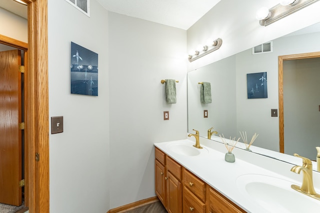 506 6th Pl NE, Byron, MN 55920 - full bath with double vanity, visible vents, and a sink