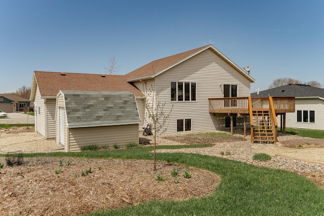 506 6th Pl NE, Byron, MN 55920 - rear view of property with stairway, a shingled roof, and a wooden deck