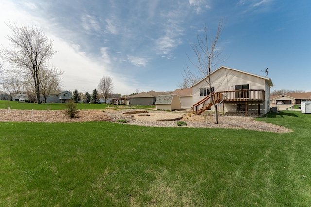 506 6th Pl NE, Byron, MN 55920 - view of yard featuring stairs, a garage, and a deck