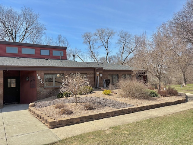 1826 Coolidge Ct, Northfield, MN 55057 - view of front facade featuring brick siding and a shingled roof