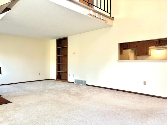 1826 Coolidge Ct, Northfield, MN 55057 - carpeted spare room featuring baseboards, built in features, and visible vents