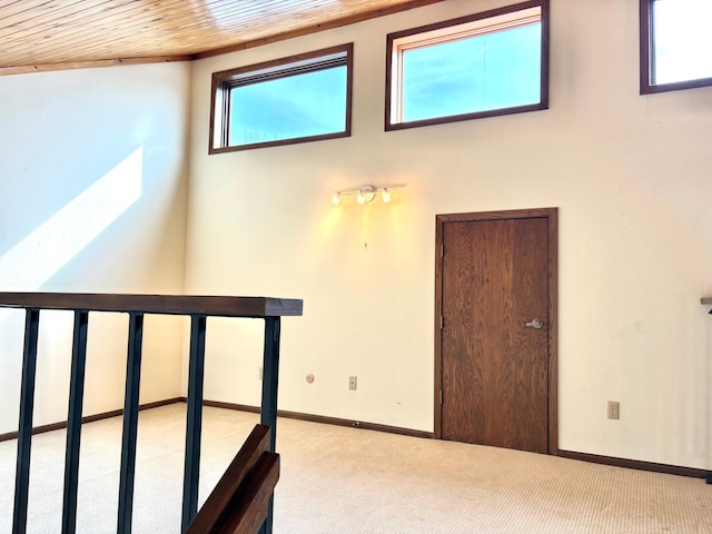1826 Coolidge Ct, Northfield, MN 55057 - stairway featuring baseboards, carpet, and wood ceiling