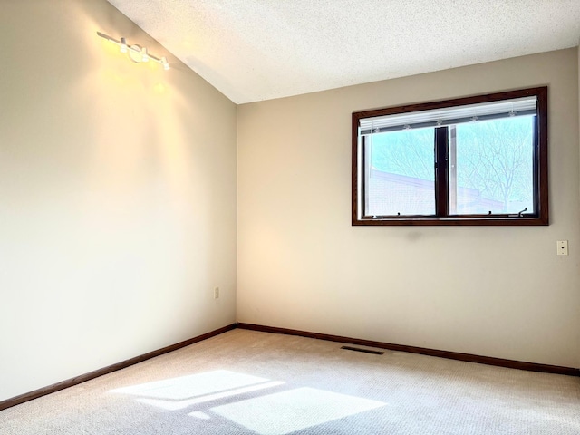 1826 Coolidge Ct, Northfield, MN 55057 - carpeted empty room featuring baseboards, a textured ceiling, and visible vents