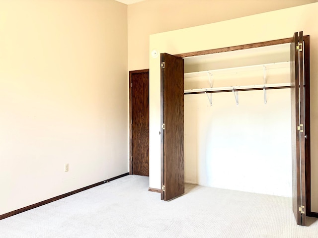 1826 Coolidge Ct, Northfield, MN 55057 - unfurnished bedroom featuring baseboards, carpet flooring, and a closet
