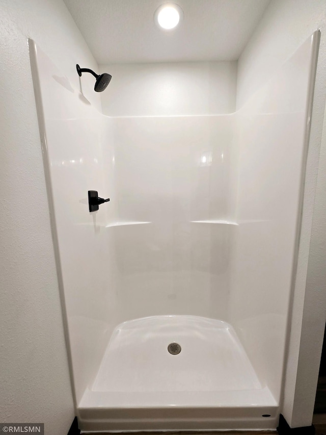 full bath featuring a stall shower