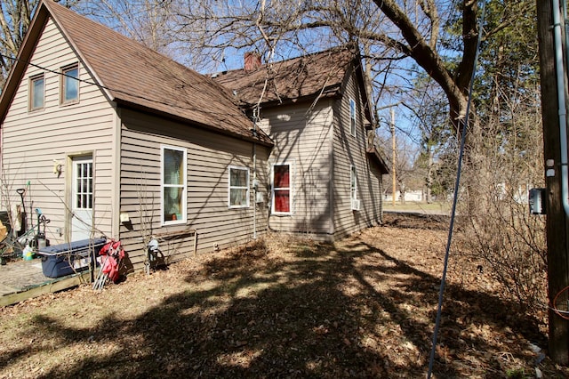 23585 Cross Dr, Deerwood, MN 56444 - view of home's exterior featuring a chimney
