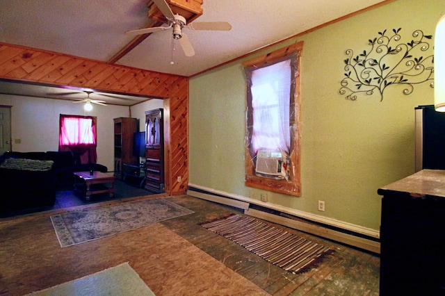 23585 Cross Dr, Deerwood, MN 56444 - unfurnished bedroom featuring wood finished floors, a baseboard radiator, cooling unit, wooden walls, and a ceiling fan