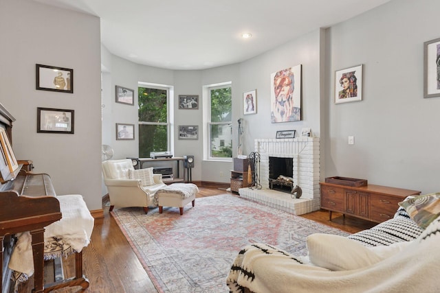 231 Arundel St Unit 1, Saint Paul, MN 55102 - living room featuring a fireplace, wood finished floors, and recessed lighting