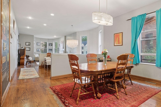 231 Arundel St Unit 1, Saint Paul, MN 55102 - dining room with wood finished floors, recessed lighting, and a chandelier