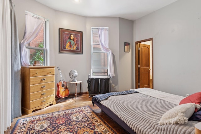 231 Arundel St Unit 1, Saint Paul, MN 55102 - bedroom featuring multiple windows and wood finished floors