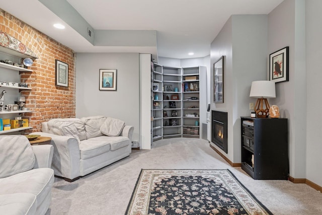 231 Arundel St Unit 1, Saint Paul, MN 55102 - carpeted living room with a glass covered fireplace, brick wall, and recessed lighting