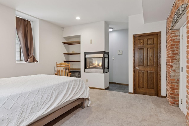 231 Arundel St Unit 1, Saint Paul, MN 55102 - carpeted bedroom with a multi sided fireplace and recessed lighting