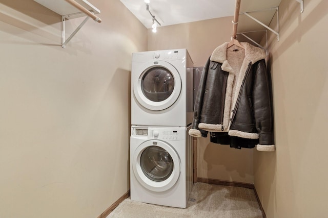 231 Arundel St Unit 1, Saint Paul, MN 55102 - washroom featuring stacked washer / drying machine and carpet flooring