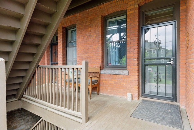 231 Arundel St Unit 1, Saint Paul, MN 55102 - view of exterior entry with brick siding and covered porch