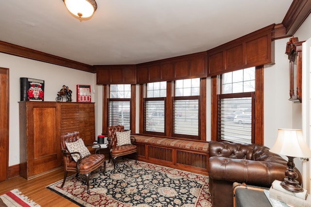 818 Summit Ave, Saint Paul, MN 55105 - living room with light wood-style flooring, ornamental molding, and baseboards