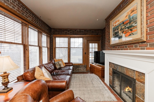 818 Summit Ave, Saint Paul, MN 55105 - living room with brick wall, a tile fireplace, and plenty of natural light