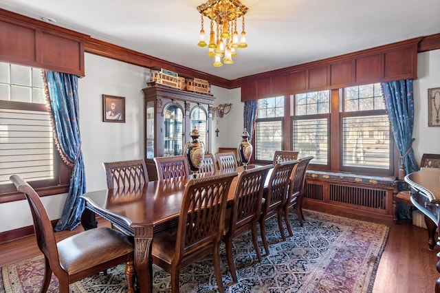 818 Summit Ave, Saint Paul, MN 55105 - dining room featuring a chandelier and wood finished floors