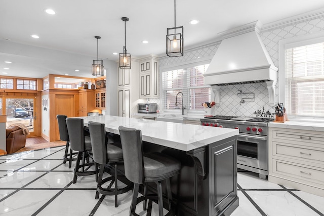 818 Summit Ave, Saint Paul, MN 55105 - kitchen featuring designer range, inlaid floor details, premium range hood, a sink, and light marble finish flooring