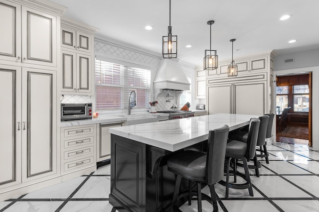 818 Summit Ave, Saint Paul, MN 55105 - kitchen featuring inlaid floor details, dishwashing machine, a sink, light marble finish flooring, and recessed lighting