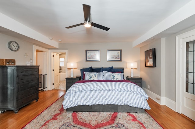 818 Summit Ave, Saint Paul, MN 55105 - bedroom featuring wood finished floors, baseboards, ceiling fan, and ensuite bath