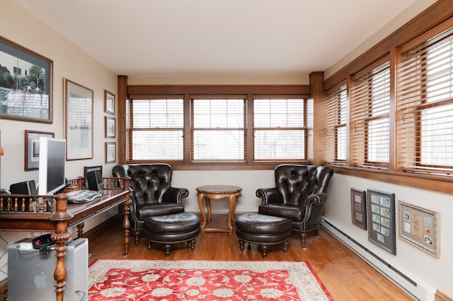 818 Summit Ave, Saint Paul, MN 55105 - sitting room with a baseboard heating unit, wood finished floors, and an office area