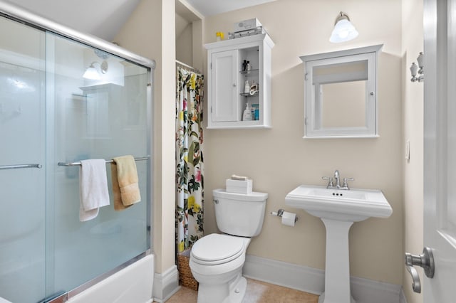 818 Summit Ave, Saint Paul, MN 55105 - bathroom featuring toilet, baseboards, and a sink