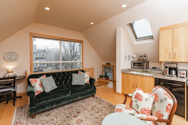 818 Summit Ave, Saint Paul, MN 55105 - living room featuring light wood-style floors, lofted ceiling, a skylight, and recessed lighting